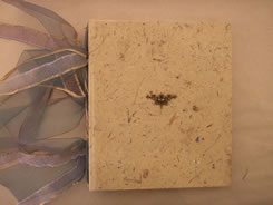 hand-made tan paper, net on spine